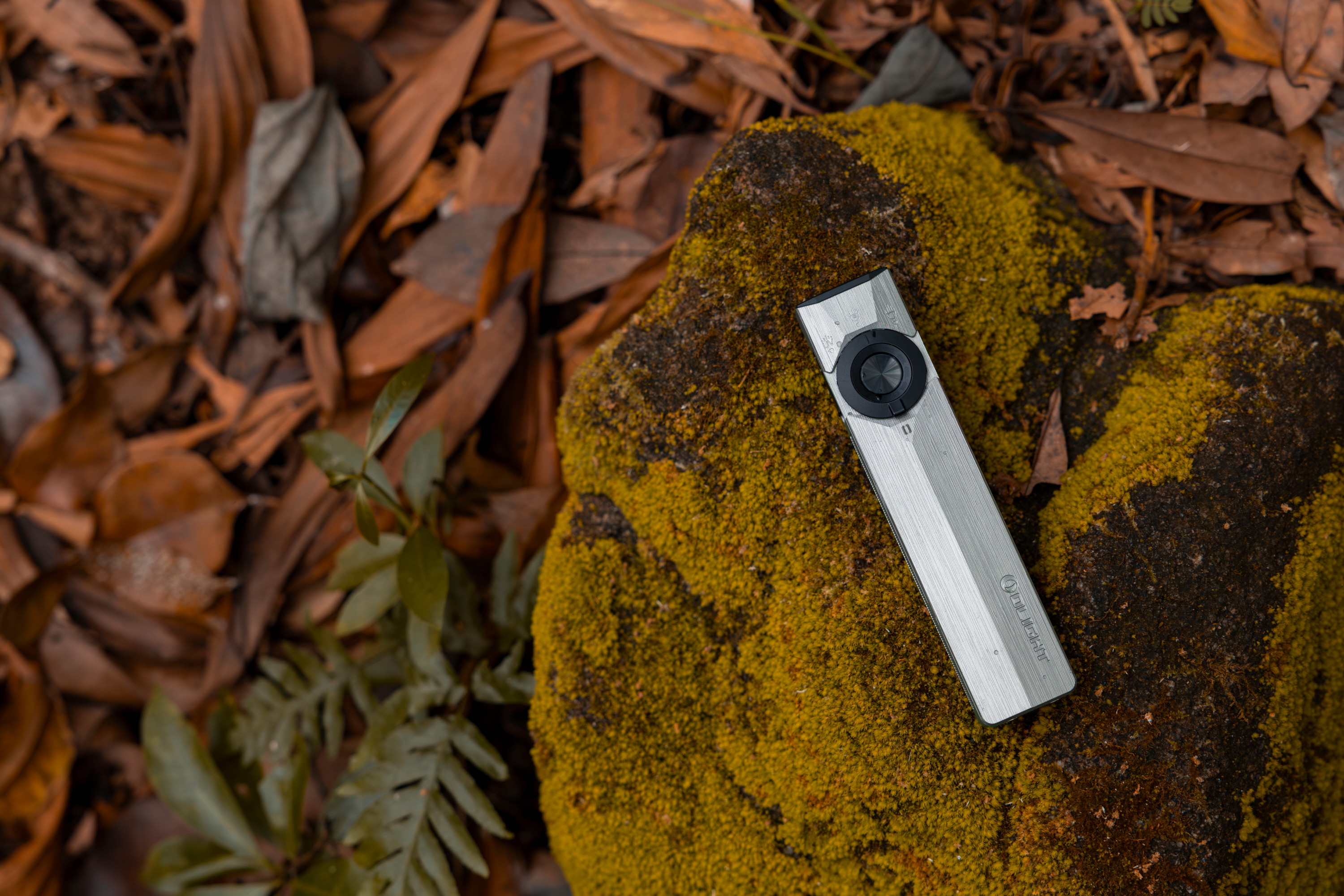 Olight C.O.R.E. Titanium Collection showcasing the ArkPro Ultra Titanium flashlight