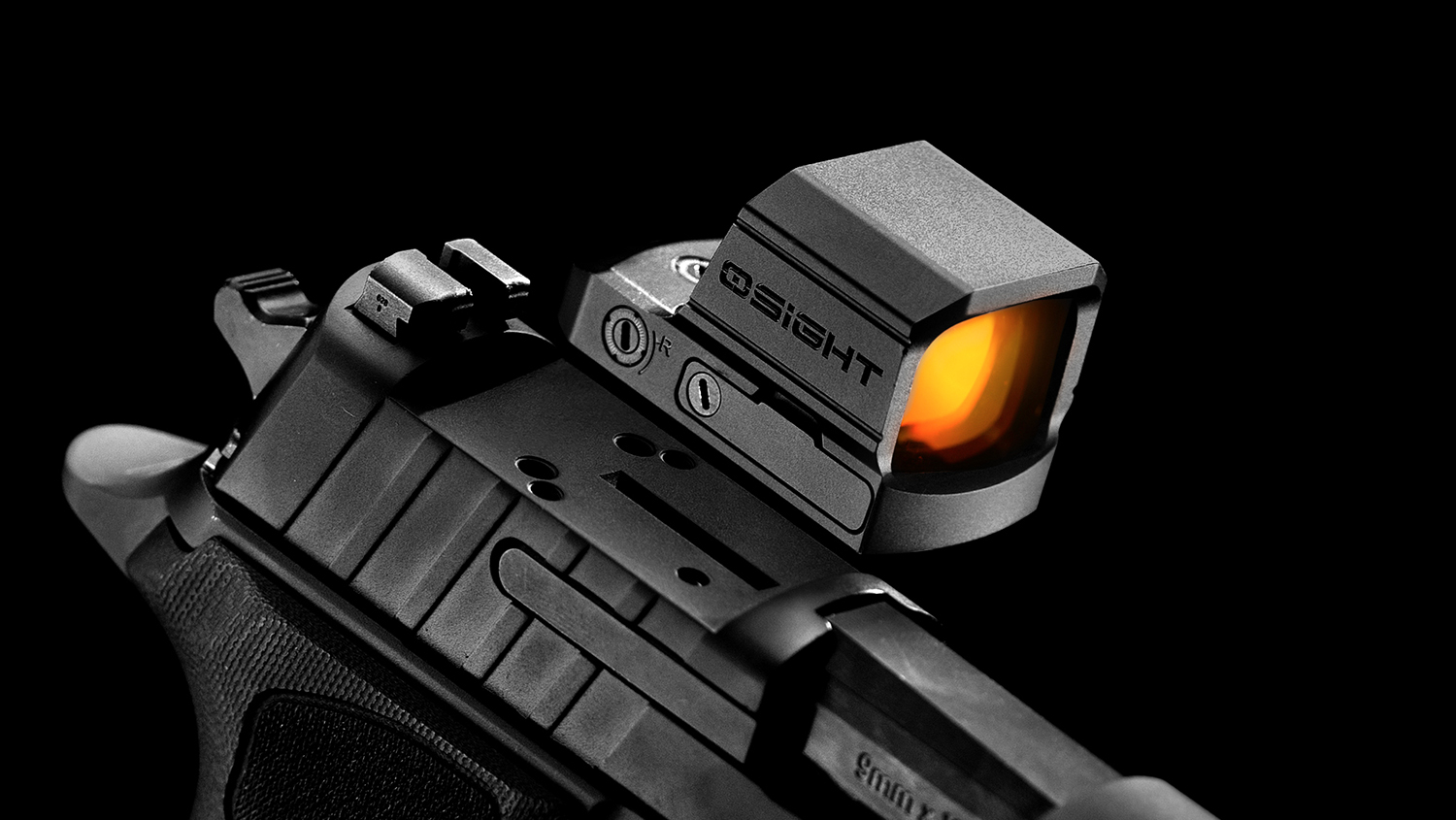 Olight Osight red dot sight mounted on a black semi-automatic pistol slide against a dark background, showing the orange-tinted optical lens and adjustment controls.