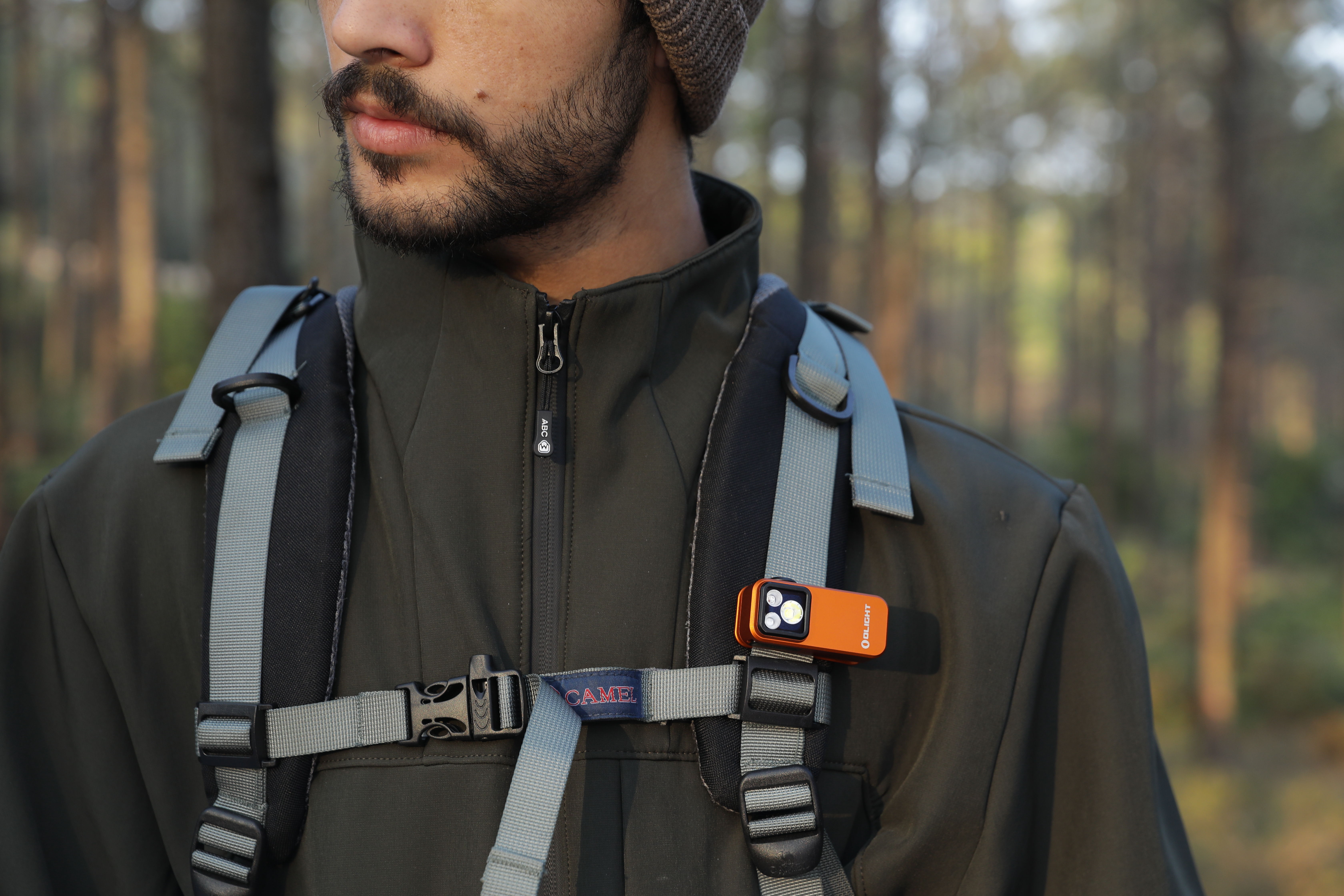 Clip-on EDC flashlight lighting system featuring UV, white, red, green, and blue light modes