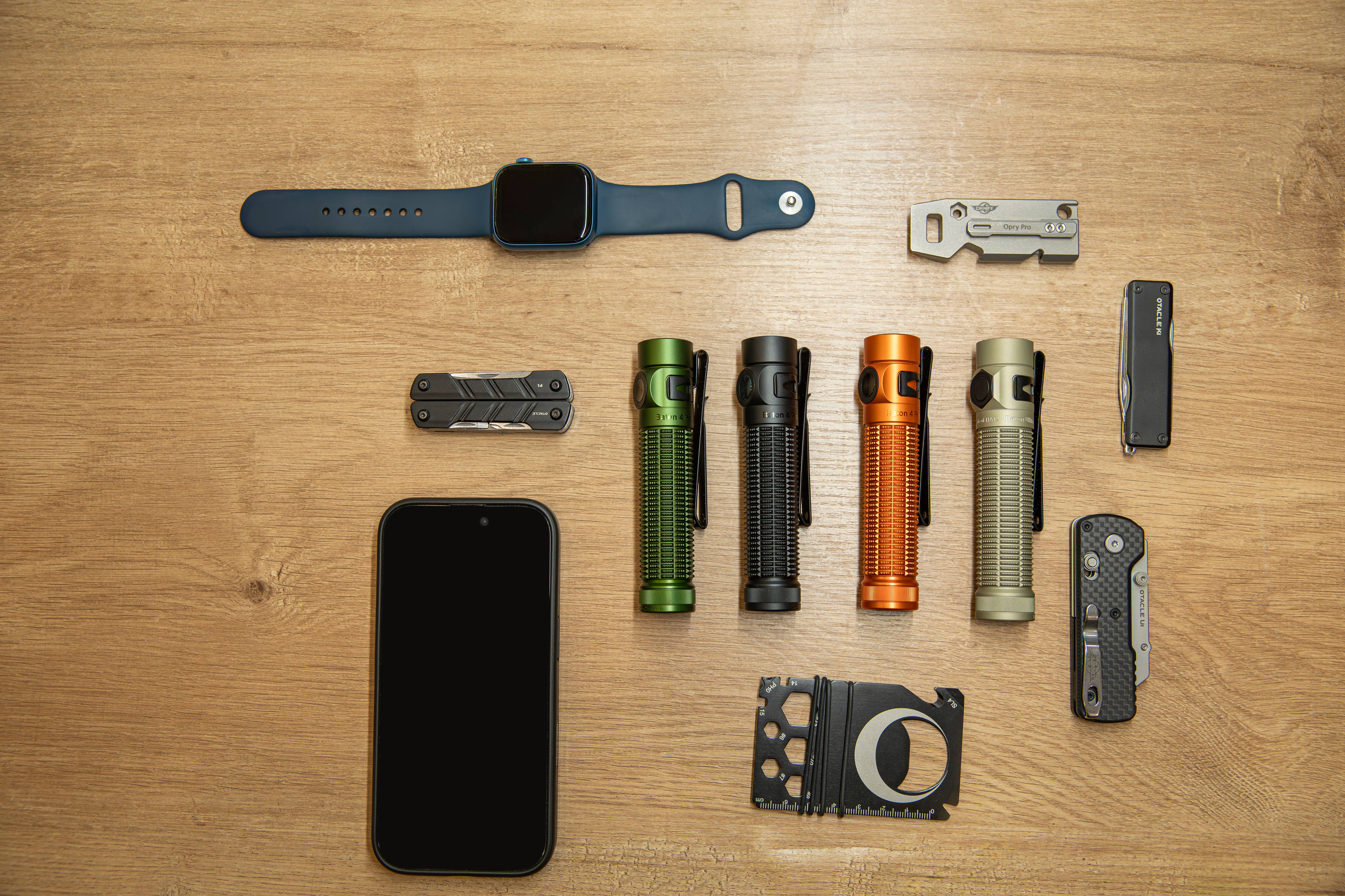 Compact olive green EDC flashlight in pocket