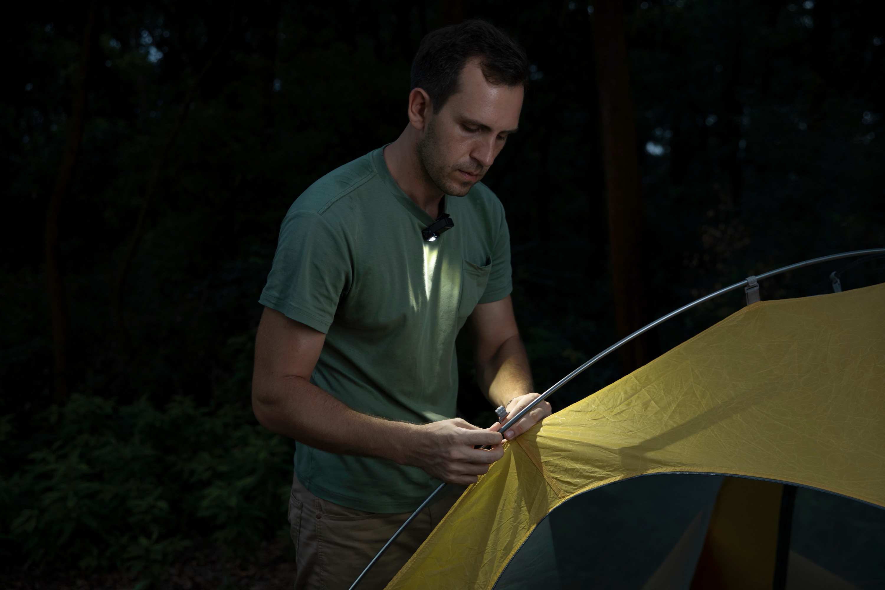 Using a clip light to set up a tent