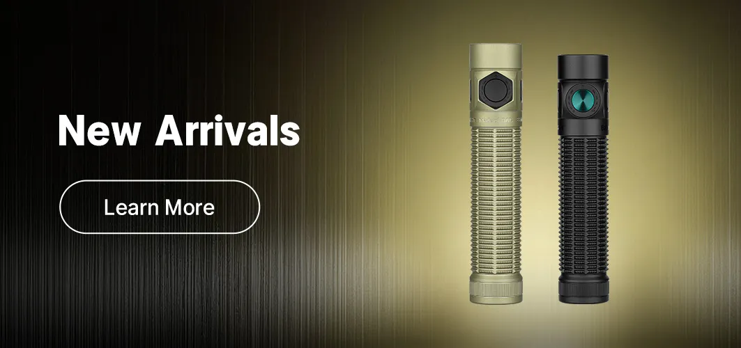 Everyday carry (EDC) gear collection on a wooden desk featuring Olight Baton 4 flashlights in multiple colors