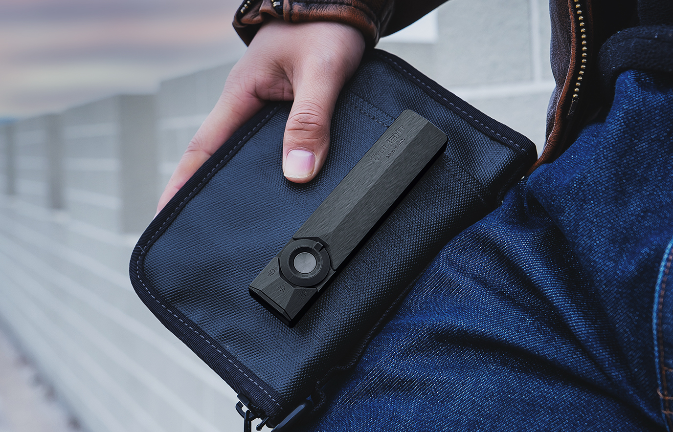 Olight ArkPro Ultra flat EDC flashlight slim profile in pocket carry &mdash; Flat Unibody design for everyday carry comfort